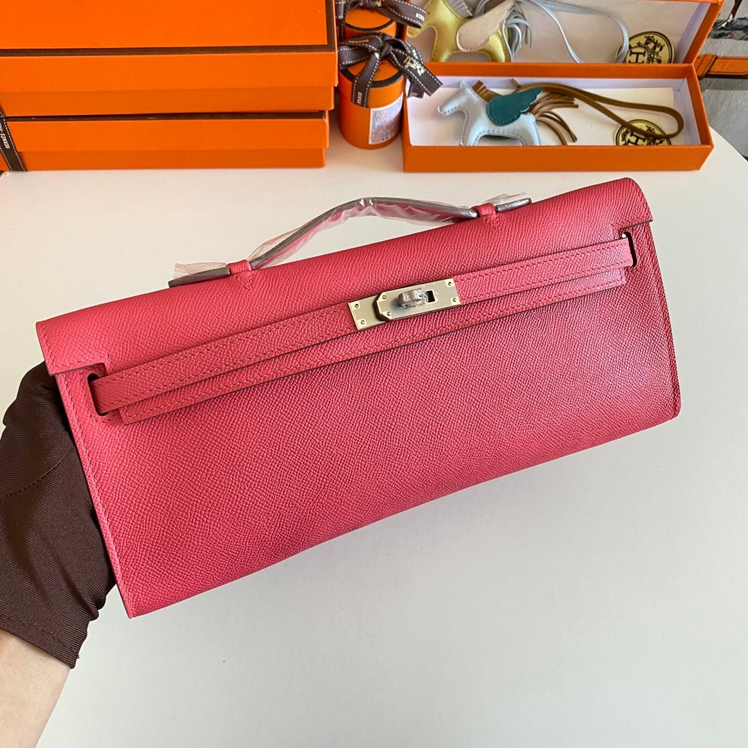 Alternative view of HERMES KELLY CUT 31 IN WATERMELON PINK CALFSKIN WITH SILVER HARDWARE