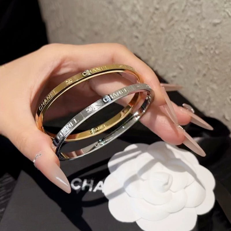 CHANEL Engraved Thin Two-Tone Text Bangle Pair