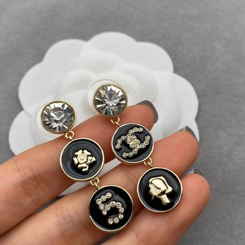 Alternative view of CHANEL Asymmetric Multi Disc Number 5 Drop Earrings