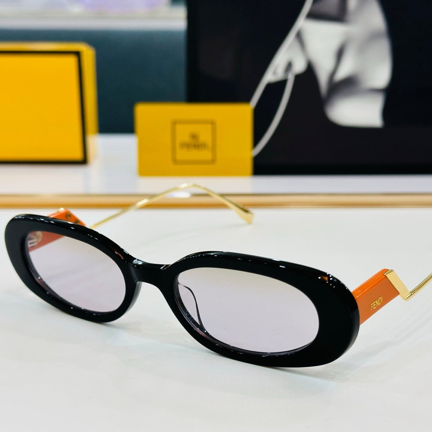 Fendi Oval Frame Sunglasses with FF Arms